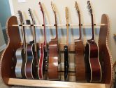 wood guitar stand holding 7 instruments
