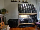 two tiered guitar case shelf rack in living room