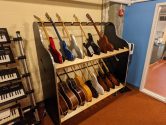 guitar storage shelf next to keyboard shelf