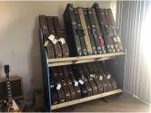 double decker shelves holding acoustic and electric guitar cases