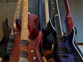 electric guitars in rotating wooden guitar stand