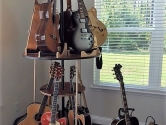 two tiered, 12 guitar stand net to a window