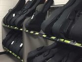 side angle of two racks holding soft guitar cases