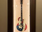 gibson guitar in a wood display case