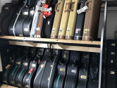 double tier guitar shelf rack holding cases