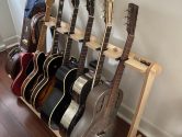 resonator guitars resting in a wood guitar stand