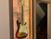 Guitar Display Case holding a sunburst stratocaster