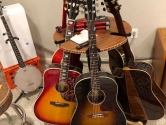 rotating stand holding acoustic guitars