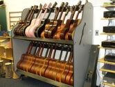 The Band Room™ Guitar Rack in a classroom next to A/V equipment