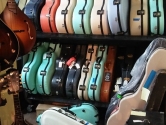 storage room with colorful guitar cases