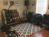 music studios with amplifiers, pedals and guitar cases