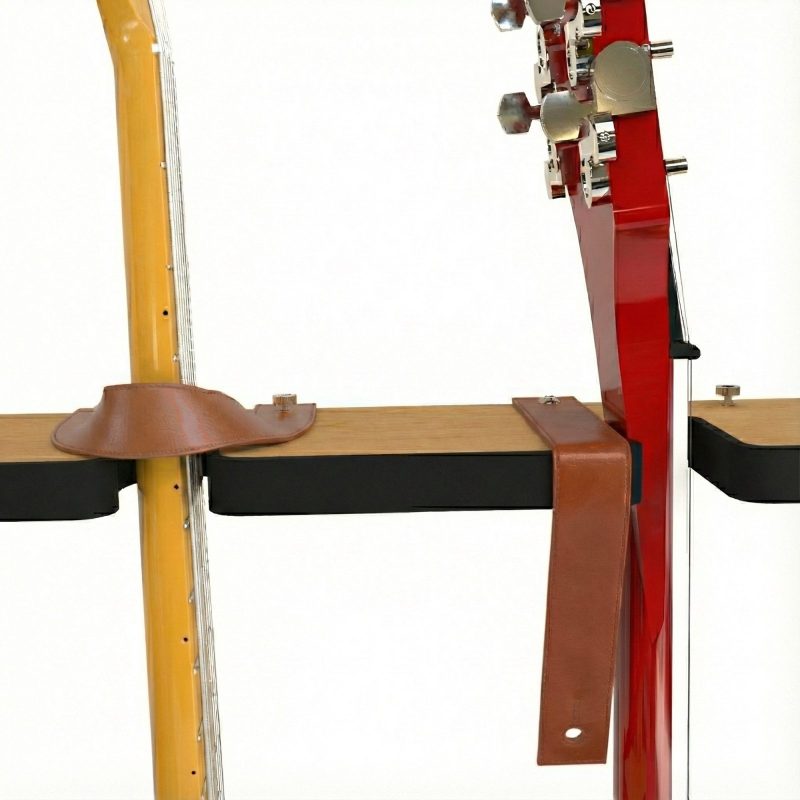 two guitar necks in slots in a rail, held by leather straps